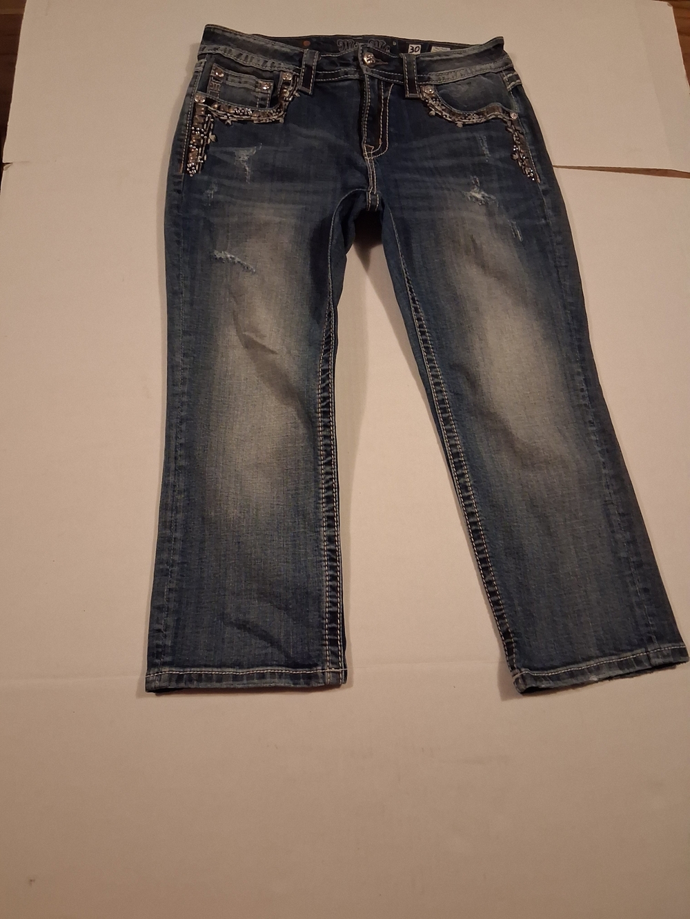 The Miss Me Mid-rise Cuffed Capri Jeans